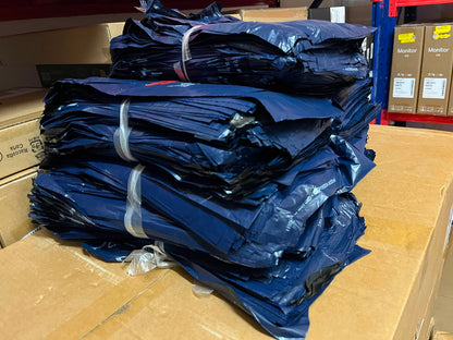 Stack of lazada pouches on a cardboard surface with boxes in the background